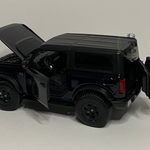 new ford bronco with all doors and hood open showing all the details of the inside